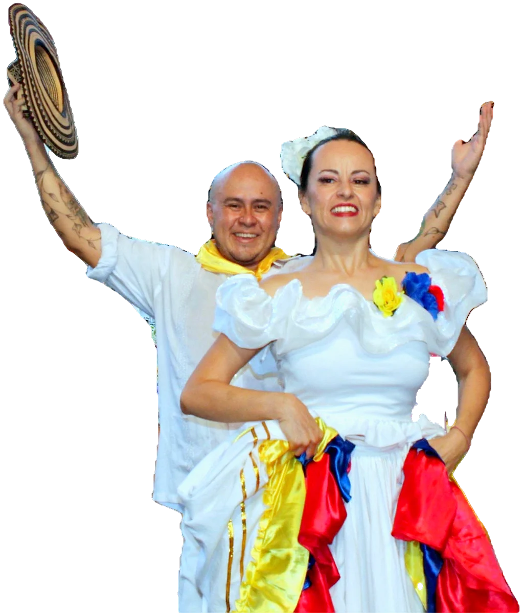 A CDG couple: she fans her tricolour pollera, he raises his sombrero vueltiao.